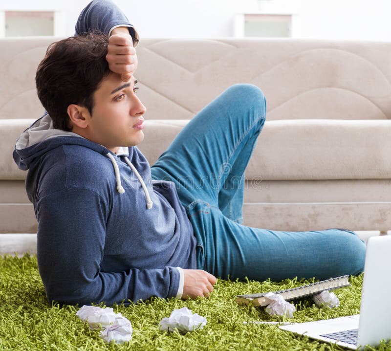 Handsome student working at startup project at home stock photo