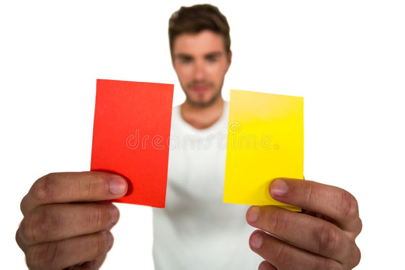 Handsome supporter showing red and yellow cards stock photo Handsome supporter showing red and yellow cards stock photo