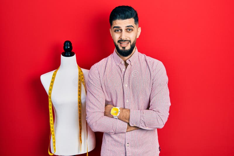 Handsome tailor man with beard with arms crossed gesture clueless and confused expression royalty free stock photo