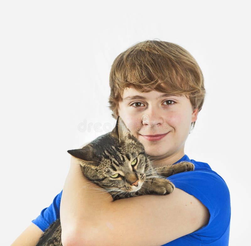 Handsome teenage boy with his cat