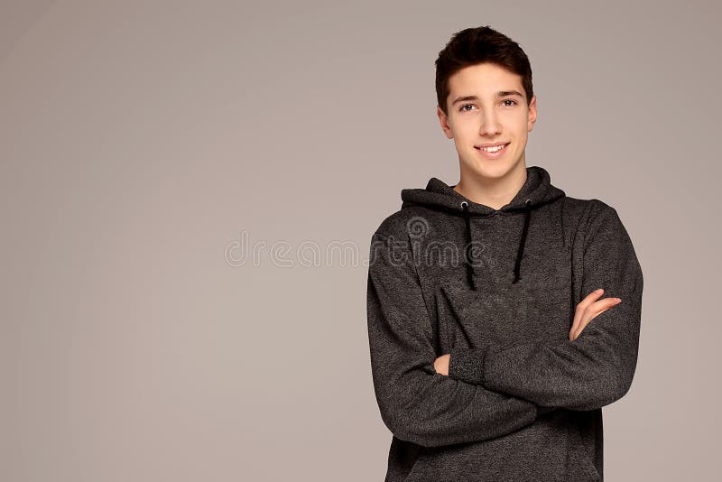 Handsome teenage boy in hoodie