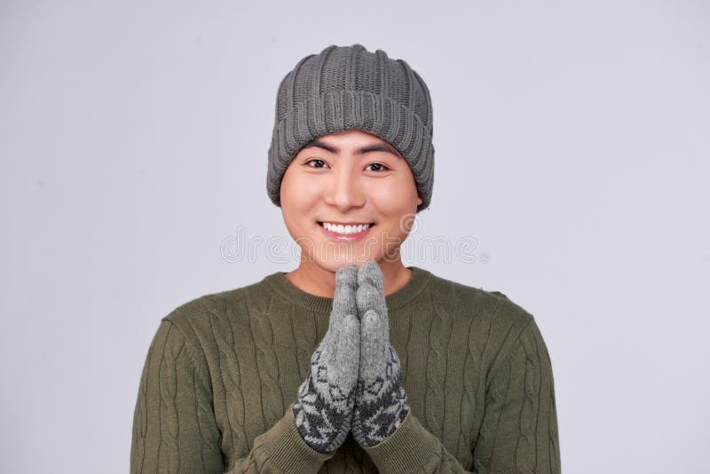 Handsome winter asian man in knitted woolen clothing hat stock images Handsome winter asian man in knitted woolen clothing hat stock images