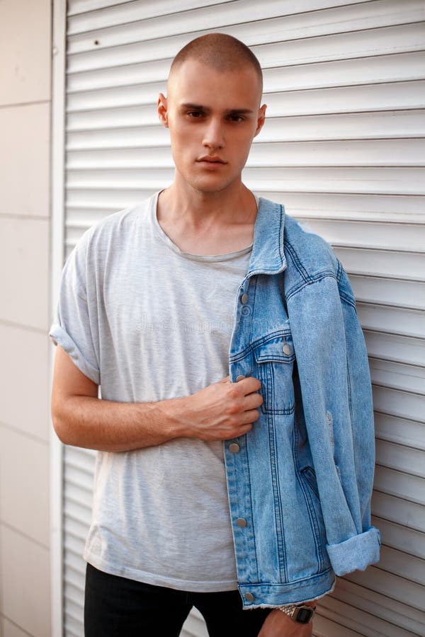 Handsome Young American Model Man in Jeans Clothes Near a White Stock ...