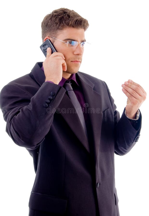 Handsome young businessman busy with cell phone