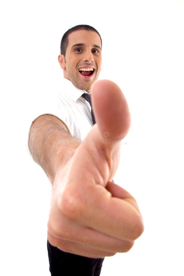 Handsome young businessman with thumbs up