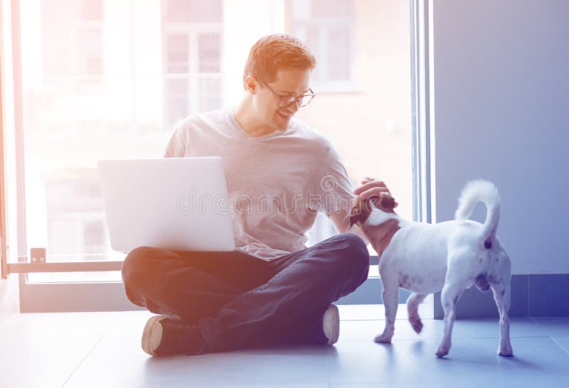 Handsome young freelancer man using laptop computer stock images Handsome young freelancer man using laptop computer stock images