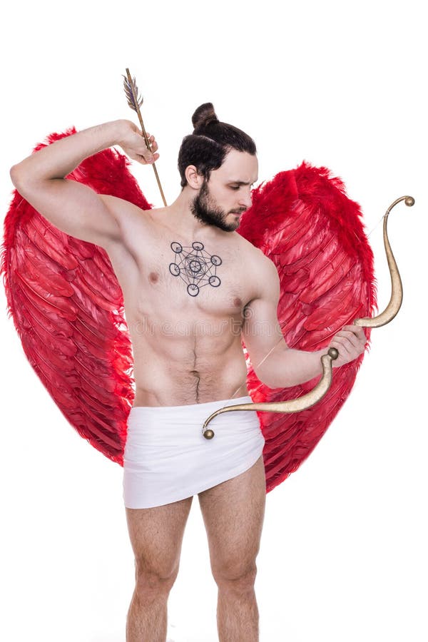 Handsome young guy dressed like Cupid with bow and arrows. 