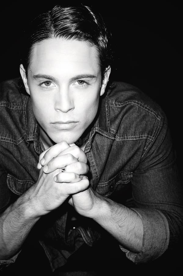 Handsome young male model looking at you stock image