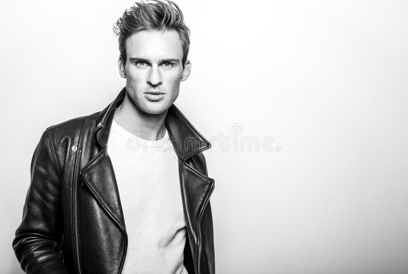 Handsome Young Man in Classic Leather Jacket. Black-white Studio ...