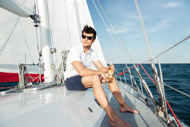 white man on yacht