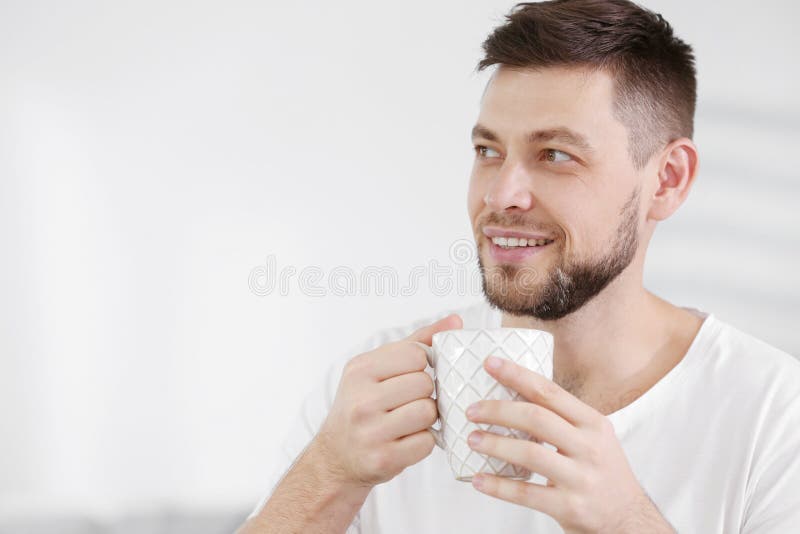 Handsome young man drinking coffee at home royalty free stock images Handsome young man drinking coffee at home royalty free stock images
