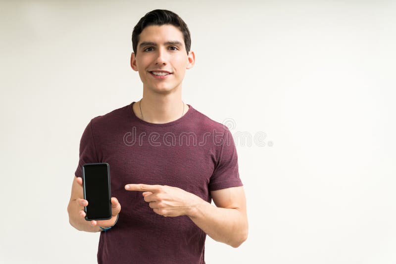 Excited Man Enjoying News on Mobile Phone in Studio Stock Image - Image ...