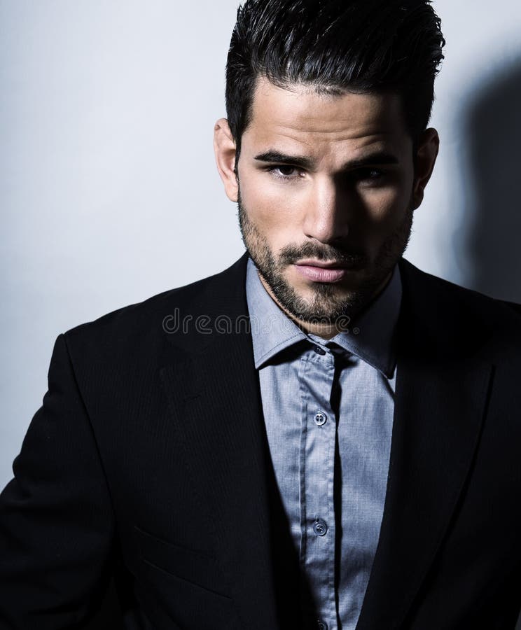 Handsome Young Business Man in Suit on Grey Background Stock Image