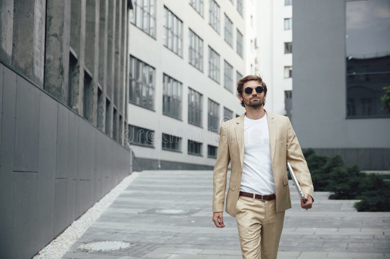 Handsome Man Walking Near Business Center with Laptop Stock Photo ...