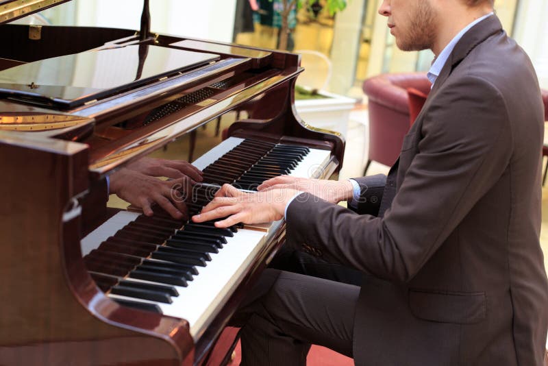 Men playing piano with their penis