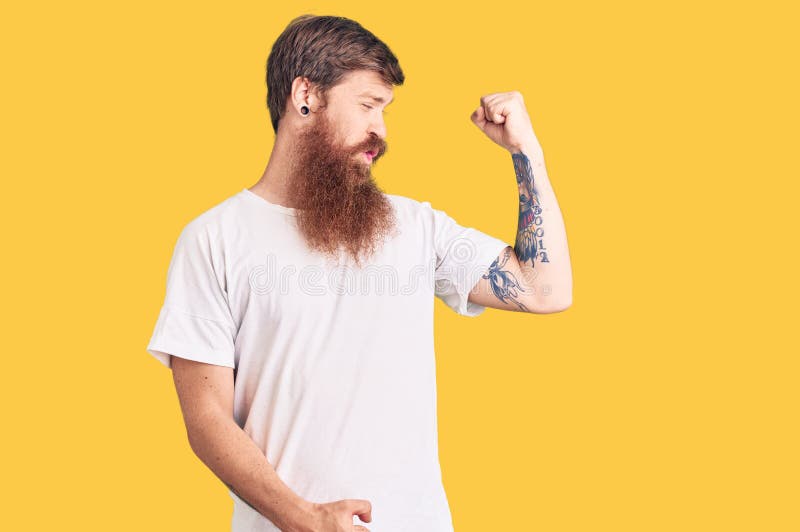 Handsome Young Red Head Man with Long Beard Wearing Casual White Tshirt