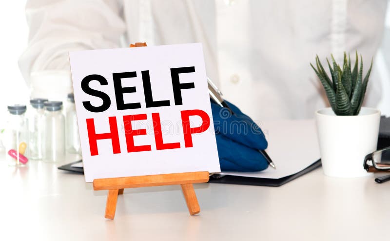 Handtag 'Self-Help' bok affärskoncept arkivbilder