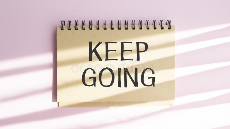 Handwriting Announcement text showing Keep Going. Business concept for Go Moving Forward Letting written on notebook royalty free stock photos