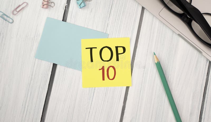 Announcement text showing Top 10 Ten List. Business concept for Success ten list written on sticky note paper on the royalty free stock photo