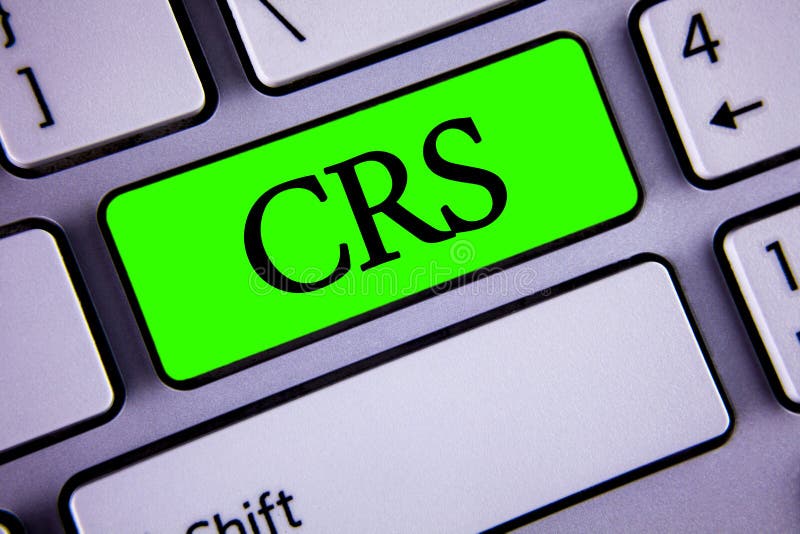 Handwriting text Crs. Concept meaning Common reporting standard for sharing tax financial information written on Green Key Button. Concept meaning Common reporting standard for sharing tax financial information written Green Key Button White Keyboard with copy space. Top view.