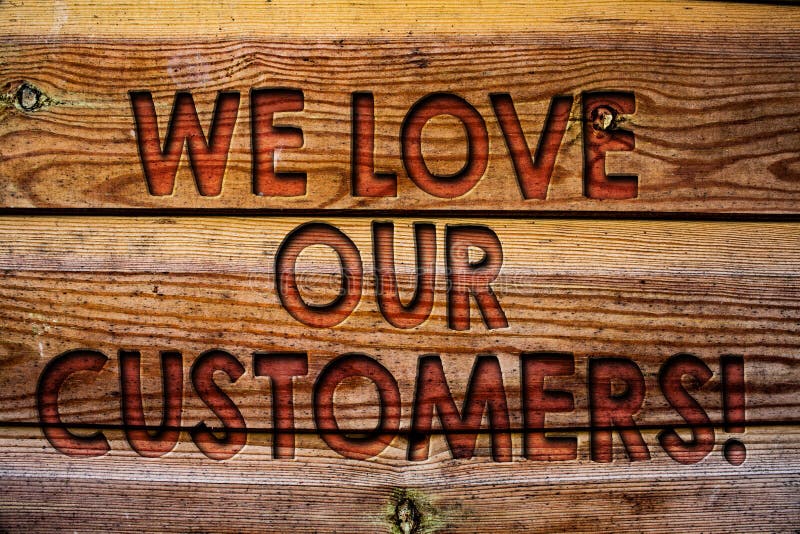 Handwriting text We Love Our Customers Call. Concept meaning Client deserves good service satisfaction respect Wooden background vintage wood board wild message ideas intentions thoughts