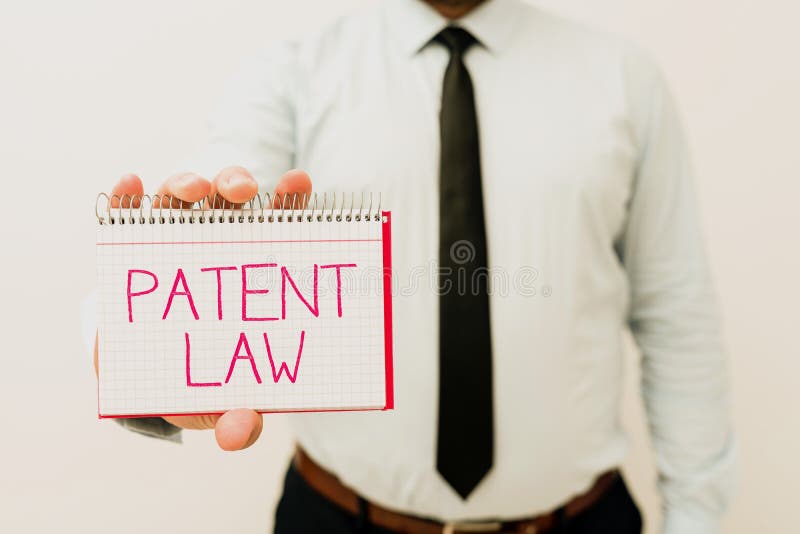 Handwriting text Patent Law. Word for deals with an inventor s is exclusive right to use own invention Presenting New stock photography