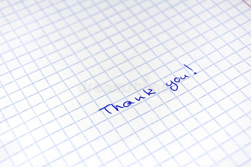 Handwritten inscription Thanks to the blue pen on a sheet in a cage