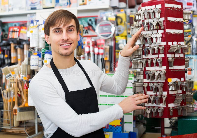 Handyman making door keys stock photo. Image of male 75326110