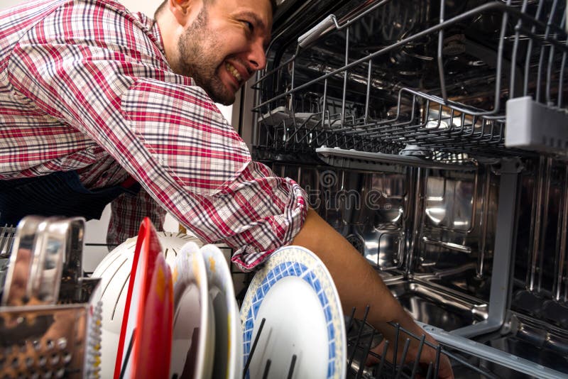 Worker Repairs Dishwasher in the Kitchen Stock Photo Image of adult