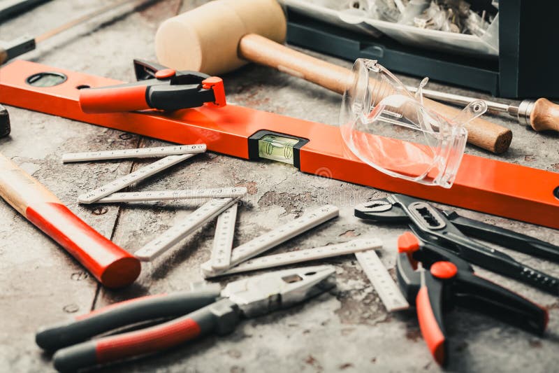 Handyman tool kit with assorted tools, goggles royalty free stock image