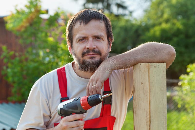 Handyman working in the yard stock photo