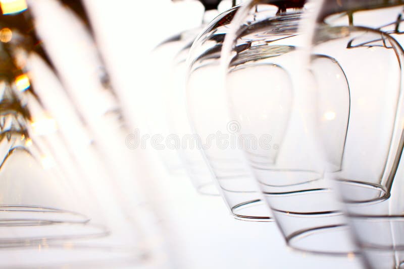 Two types hanging wineglasses isolated over white background. Two types hanging wineglasses isolated over white background