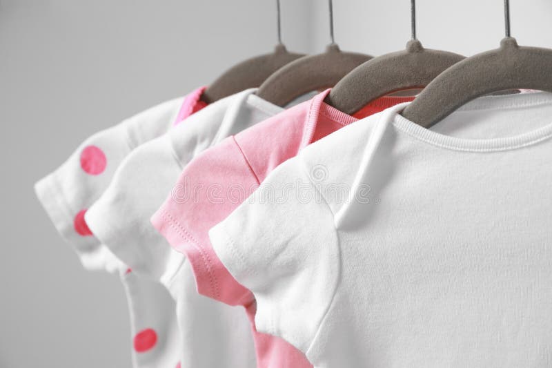 Hangers with Baby Clothes on Rack Stock Photo - Image of garments, inside:  132793586