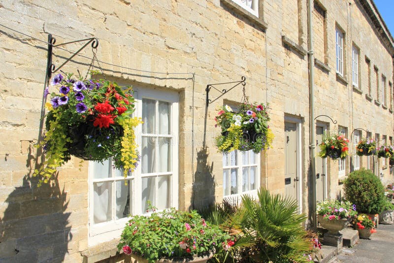 Hanging baskets in the village Cirencester in England.