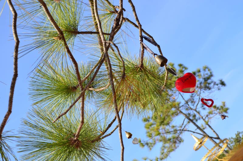 Hanging Bell and Ceramic Heart Stock Photo Image of string, design