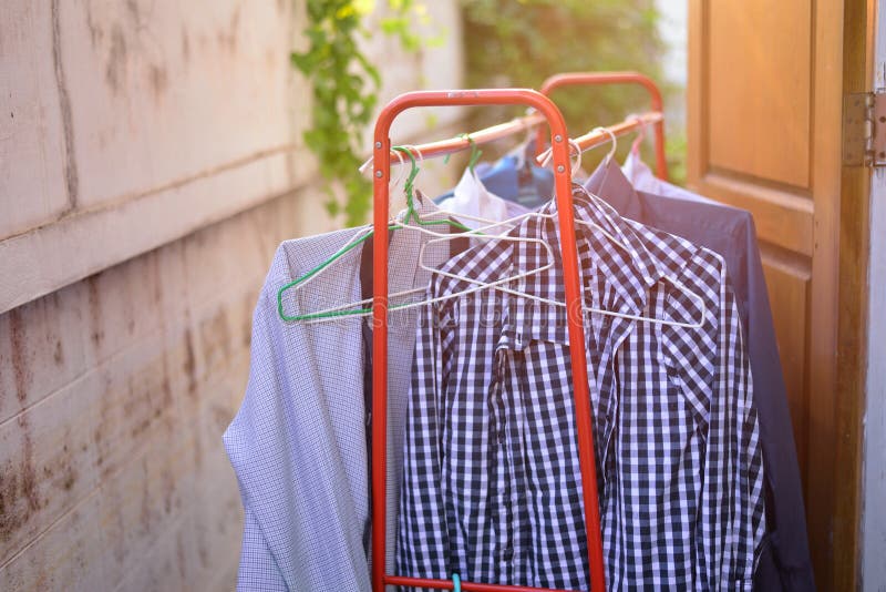 Hanging dry the clothes stock photo. Image of coat, clothes 68753748
