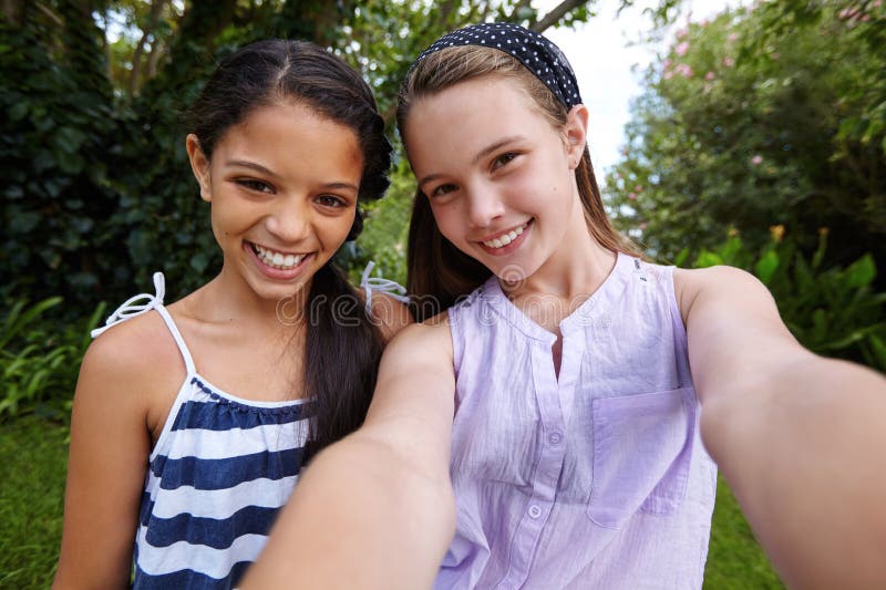 Its a Bestie Selfie only. Two Young Friends Sitting Together and Using ...