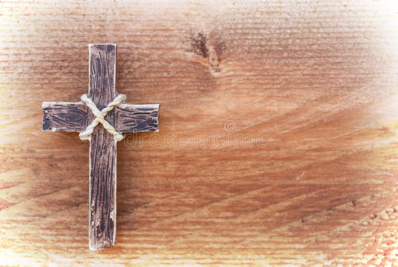 Hanging wooden cross on old wood background stock photography Hanging wooden cross on old wood background stock photography