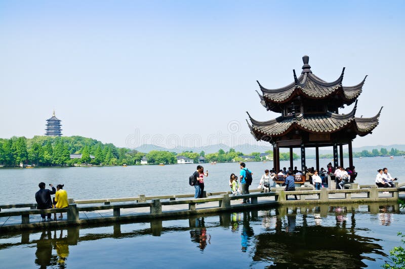 Hangzhou west lake landscape, in China. Hangzhou - May 2: people to rest in the pavilion near the west lake. On May 2, 2014 in hangzhou, China.The distance is stock images Hangzhou west lake landscape, in China. Hangzhou - May 2: people to rest in the pavilion near the west lake. On May 2, 2014 in hangzhou, China.The distance is stock images