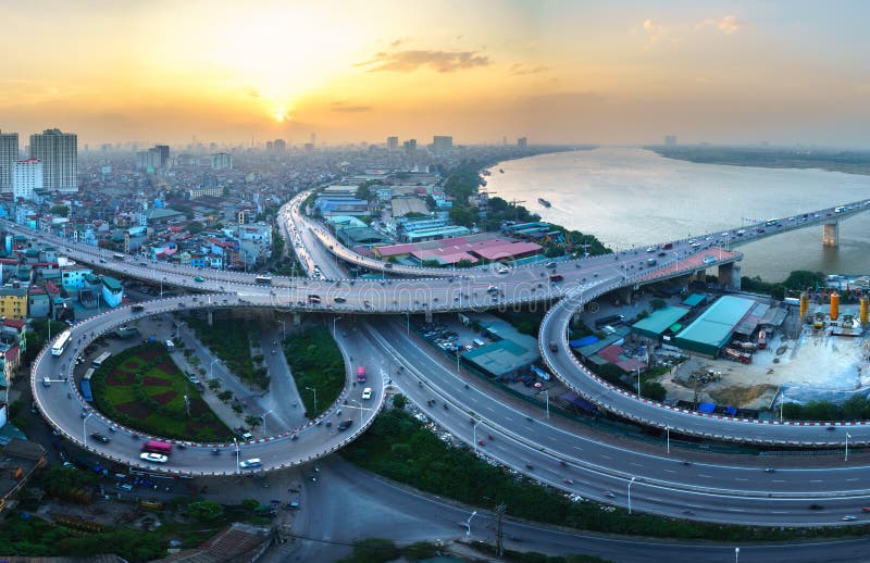 Hanoi, Vietnam - June 5, 2017: Aerial view of Hanoi cityscape by twilight period, with road junction and interchange overpass Vinh royalty free stock images Hanoi, Vietnam - June 5, 2017: Aerial view of Hanoi cityscape by twilight period, with road junction and interchange overpass Vinh royalty free stock images