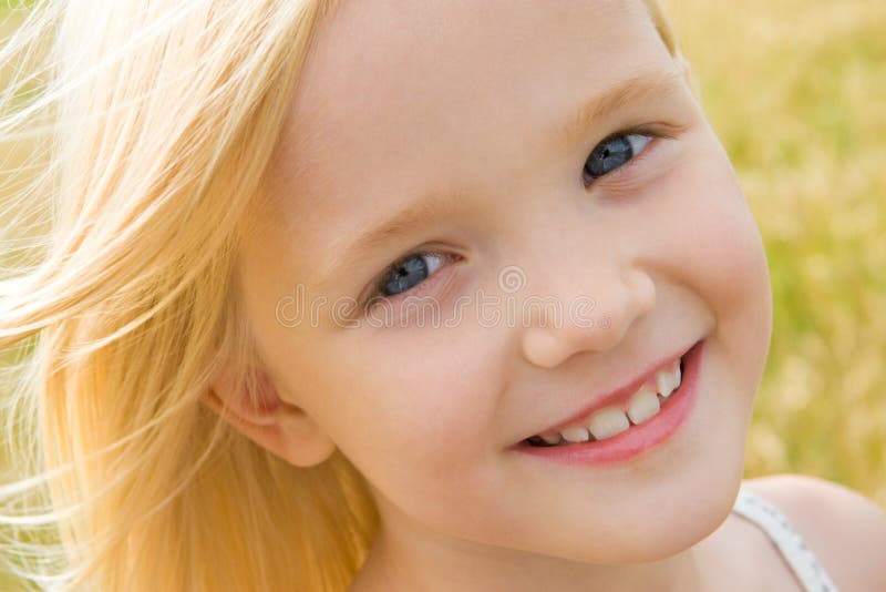 Face of youthful girl looking at camera with smile. Face of youthful girl looking at camera with smile