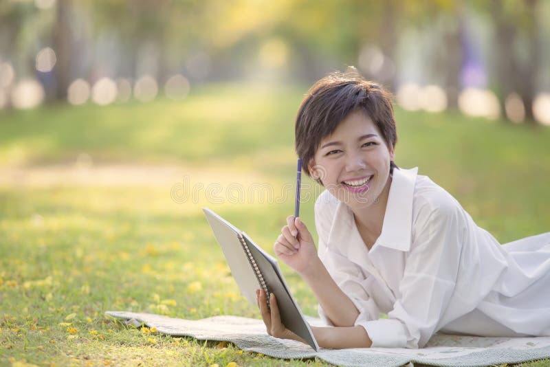 Happiness Emotion Relaxing Time Of Asian Younger Woman With Book