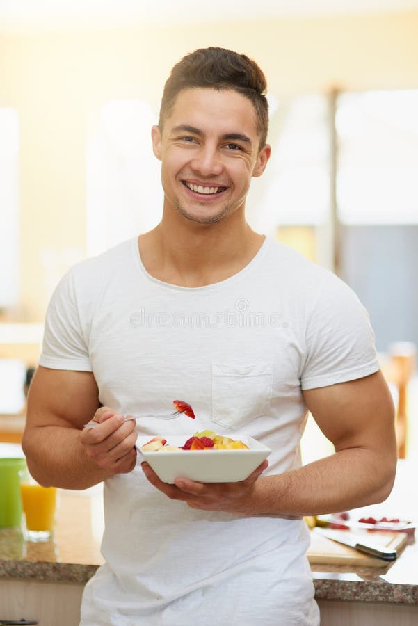 Happiness Starts with a Fiveaday Breakfast. a Young Man Eating a