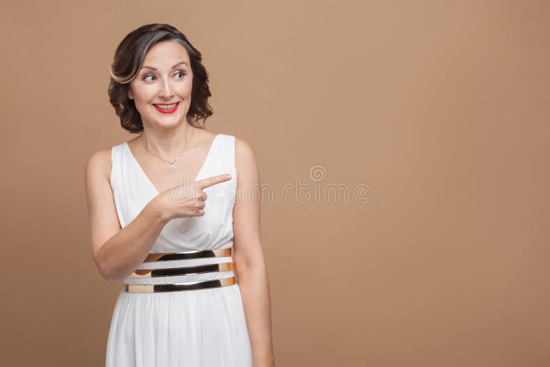 Happiness woman pointing finger at copy space