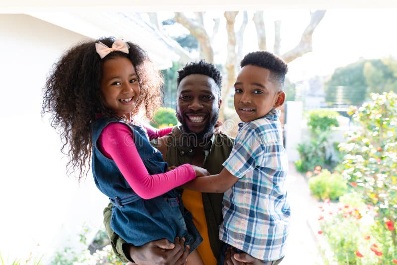 Happy African American Children Welcoming Their Father Coming Back Home