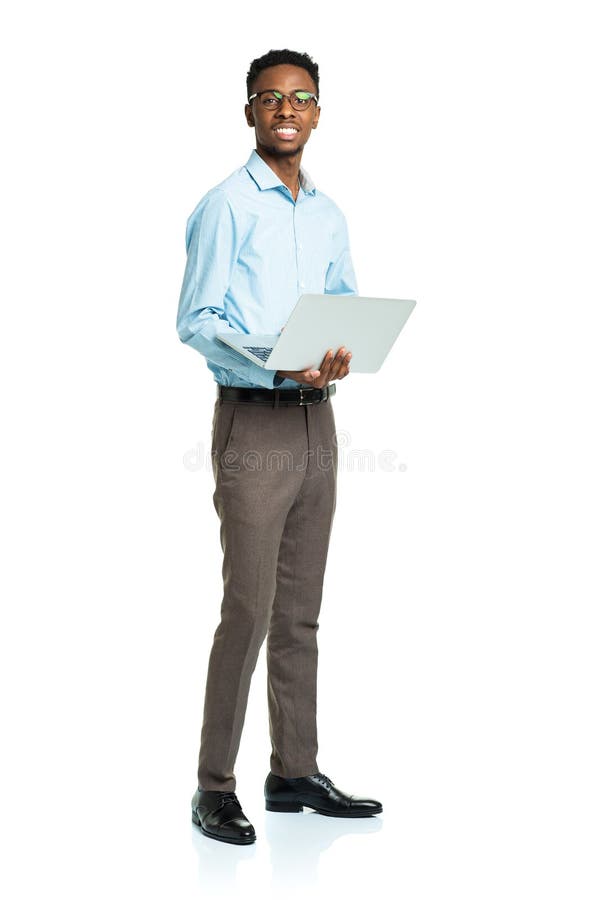 Happy african american college student with laptop standing on w