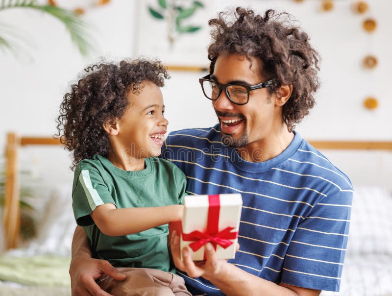 Cheerful Ethnic Father And Son Celebrating Fathers Day Together At Home