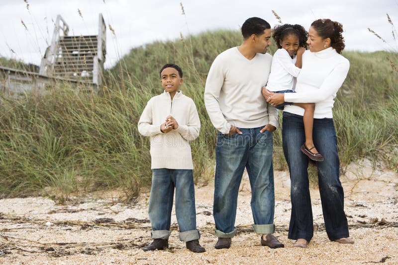 Happy African American Family Standing  Together Stock 