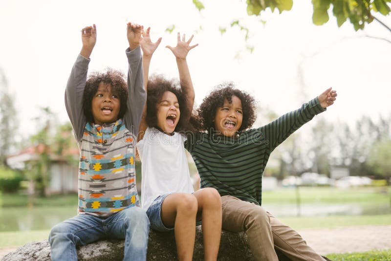 Happy African american little boy kids children joyfully cheerful and laughing. Concept of happiness.