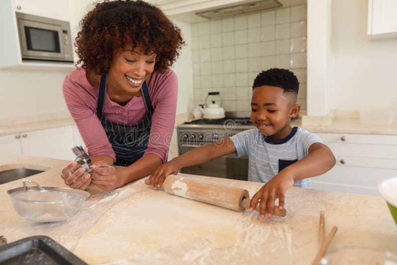 https://thumbs.dreamstime.com/b/happy-african-american-mother-son-baking-kitchen-rolling-dough-family-enjoying-quality-free-time-together-223078957.jpg